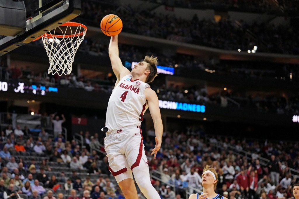 Mar 27, 2025; Newark, NJ, USA; Alabama Crimson Tide forward Grant Nelson (4) dunks the during the first half against the Brigham Young Cougars during an East Regional semifinal of the 2025 NCAA tournament at Prudential Center.